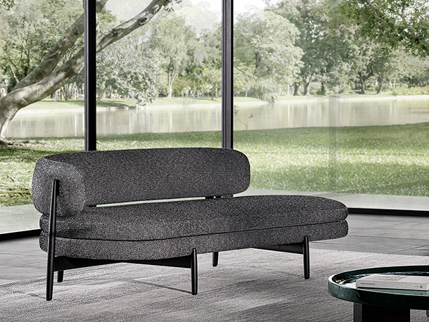 Dark gray, asymmetrical sofa with sculptural design